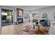 Bright living room featuring a fireplace, modern furniture, wood floors, and a sliding door to the outside at 6844 Countryside Ln # 284, Niwot, CO 80503