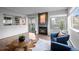Inviting living room featuring a warm fireplace, sliding door access, and comfortable seating, creating a relaxing atmosphere at 6844 Countryside Ln # 284, Niwot, CO 80503