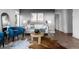 Bright living room with hardwood floors, two large windows, a white couch, and gray accent wall is ideal for relaxation at 6844 Countryside Ln # 284, Niwot, CO 80503