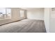 Neutral bedroom features two bright windows for lots of natural light and modern carpet at 20601 E 40Th Ave, Denver, CO 80249