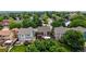 Aerial view of a home with mature trees and a well-maintained backyard at 12201 N Holly Way, Brighton, CO 80602