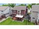 Backyard featuring a deck with patio furniture and a lawn at 12201 N Holly Way, Brighton, CO 80602