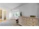 Bright bedroom featuring a large window, a cozy seat, and a classic white dresser at 12201 N Holly Way, Brighton, CO 80602
