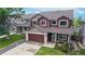 Charming two-story home with a well-manicured lawn, a two-car garage, and beautiful landscaping at 12201 N Holly Way, Brighton, CO 80602