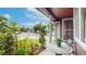 Inviting front porch with landscaping, a sitting area, and neighborhood views at 12201 N Holly Way, Brighton, CO 80602