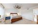Cozy bedroom featuring a ceiling fan and carpet at 12201 N Holly Way, Brighton, CO 80602