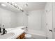 Clean bathroom featuring a shower-tub combo and a well-lit vanity area at 2082 S Helena St # C, Aurora, CO 80013