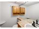 Bathroom featuring a sink with tile countertop and light colored cabinets at 2082 S Helena St # C, Aurora, CO 80013