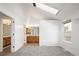 Bedroom with vaulted ceiling, skylight, and an adjacent bathroom showcasing wood cabinets and modern fixtures at 2082 S Helena St # C, Aurora, CO 80013