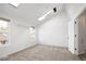 Bright bedroom with skylights, ceiling fan, and a view of the outdoors through multiple windows at 2082 S Helena St # C, Aurora, CO 80013