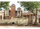 Charming home featuring a brick chimney, privacy fence, and mature trees in a tranquil setting at 2082 S Helena St # C, Aurora, CO 80013