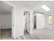 Hallway with light-toned flooring connecting multiple rooms in the home at 2082 S Helena St # C, Aurora, CO 80013
