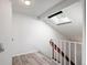 Upper landing featuring a skylight, and light-toned flooring at 2082 S Helena St # C, Aurora, CO 80013