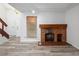 Bright living area with a charming brick fireplace and modern flooring at 2082 S Helena St # C, Aurora, CO 80013