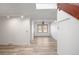 Bright living room with light-toned flooring and a skylight that provides natural light at 2082 S Helena St # C, Aurora, CO 80013