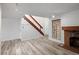 Living room featuring wood-look floors and a brick fireplace at 2082 S Helena St # C, Aurora, CO 80013