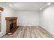 Spacious living room with modern flooring and a classic brick fireplace at 2082 S Helena St # C, Aurora, CO 80013