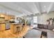 Inviting living room showcasing an island, stainless steel appliances, and hardwood floors at 33 Corona St # 207, Denver, CO 80218