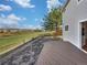 Backyard featuring a wooden deck, grassy area, with views of the landscape, perfect for outdoor enjoyment at 9515 Bexley Dr, Highlands Ranch, CO 80126