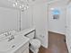 Bathroom with neutral-tone tile floors, white sink, and white walls at 9515 Bexley Dr, Highlands Ranch, CO 80126