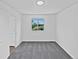 Bedroom with grey carpet, white walls, and a window with a view at 9515 Bexley Dr, Highlands Ranch, CO 80126