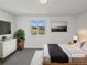 Cozy bedroom with a plush bed, view to the outside, and stylish decor for a relaxing atmosphere at 9515 Bexley Dr, Highlands Ranch, CO 80126