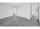 Spacious bedroom with neutral carpet and views to an en-suite bathroom at 9515 Bexley Dr, Highlands Ranch, CO 80126