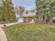 Two-story house with a neatly landscaped lawn and driveway at 824 S Nelson Way, Lakewood, CO 80226