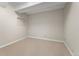 Empty basement room with neutral walls and carpet at 10890 W Belmont Ave, Littleton, CO 80127