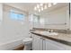 Clean bathroom with shower/tub combo and vanity at 10890 W Belmont Ave, Littleton, CO 80127