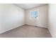 Bright bedroom with neutral walls and carpet flooring at 10890 W Belmont Ave, Littleton, CO 80127