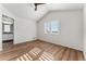 Bright bedroom with wood-look floors and ceiling fan at 10890 W Belmont Ave, Littleton, CO 80127