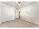 Bedroom with double door closet and carpet flooring at 10890 W Belmont Ave, Littleton, CO 80127