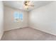 Spacious bedroom with neutral walls and carpet flooring at 10890 W Belmont Ave, Littleton, CO 80127