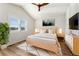 Main bedroom with wood flooring and ceiling fan at 10890 W Belmont Ave, Littleton, CO 80127