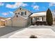 Two-story house with a three-car garage and partially snow-covered landscaping at 10890 W Belmont Ave, Littleton, CO 80127