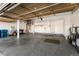 Attached garage with overhead storage and epoxy floor at 10890 W Belmont Ave, Littleton, CO 80127