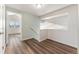 Upstairs hallway with light walls and wood-look flooring at 10890 W Belmont Ave, Littleton, CO 80127