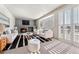 Living room with fireplace and stylish mid century modern furniture at 10890 W Belmont Ave, Littleton, CO 80127