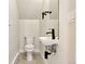 Powder room featuring a modern sink, mirror, and toilet at 1563 N Hooker St, Denver, CO 80204