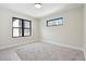 Bright bedroom features neutral walls, carpet, and contemporary black-trimmed windows offering plenty of natural light at 1563 N Hooker St, Denver, CO 80204