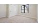 Cozy bedroom features neutral walls, carpet, and a closet with stylish sliding doors at 1563 N Hooker St, Denver, CO 80204