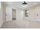 Bedroom with modern light fixture and large window at 1563 N Hooker St, Denver, CO 80204