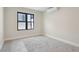 Serene bedroom with a black window and a modern air conditioning unit at 1563 N Hooker St, Denver, CO 80204