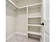 Walk-in closet features built-in shelving and rod for optimal organization at 1563 N Hooker St, Denver, CO 80204