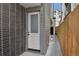 Modern home featuring a white front door with address number at 1563 N Hooker St, Denver, CO 80204