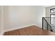 Hallway with hardwood floors and modern railings at 1563 N Hooker St, Denver, CO 80204