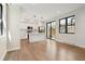 Open-concept kitchen with white cabinets, island, and stainless steel appliances at 1563 N Hooker St, Denver, CO 80204
