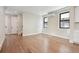 Bright living room with hardwood floors and modern black-trim windows at 1563 N Hooker St, Denver, CO 80204