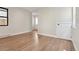 Bright living room with hardwood floors, neutral walls, and modern doors at 1563 N Hooker St, Denver, CO 80204